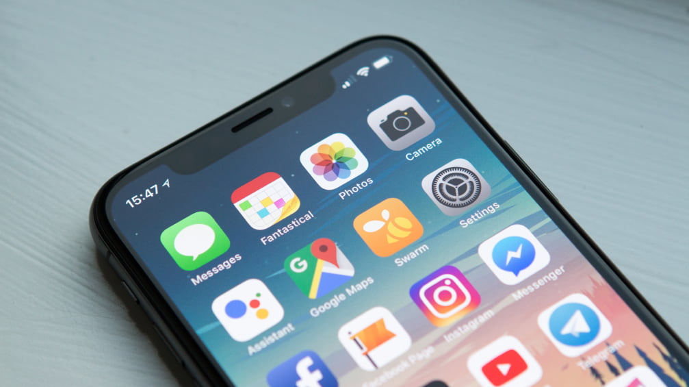 A photo of a phone displaying its home screen