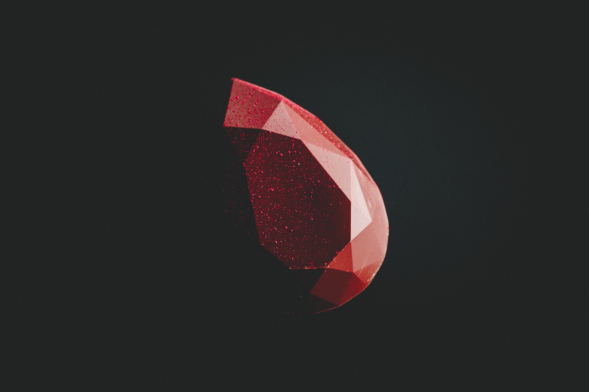 A ruby on a black background