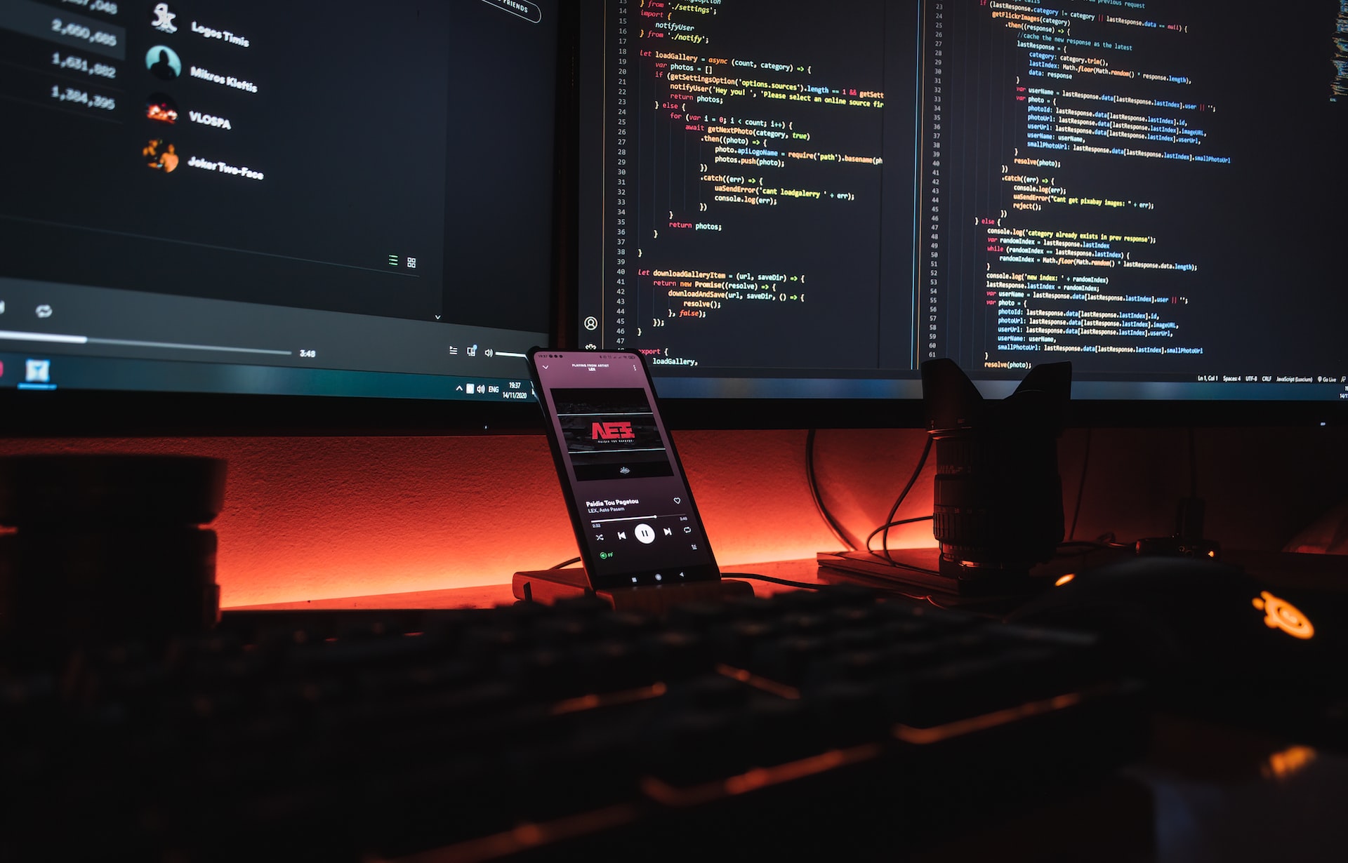 Multiple computer screens in a dimly lit room