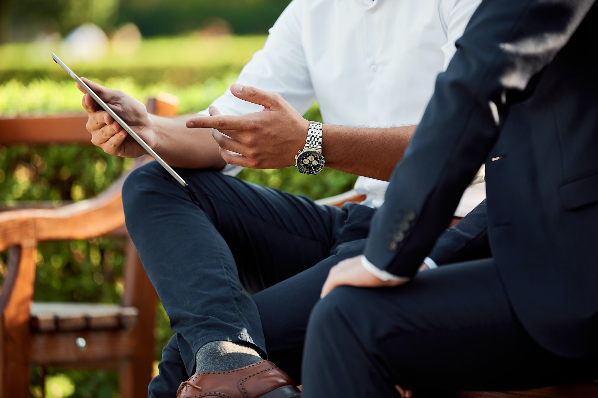 Two men having a meeting in a park.