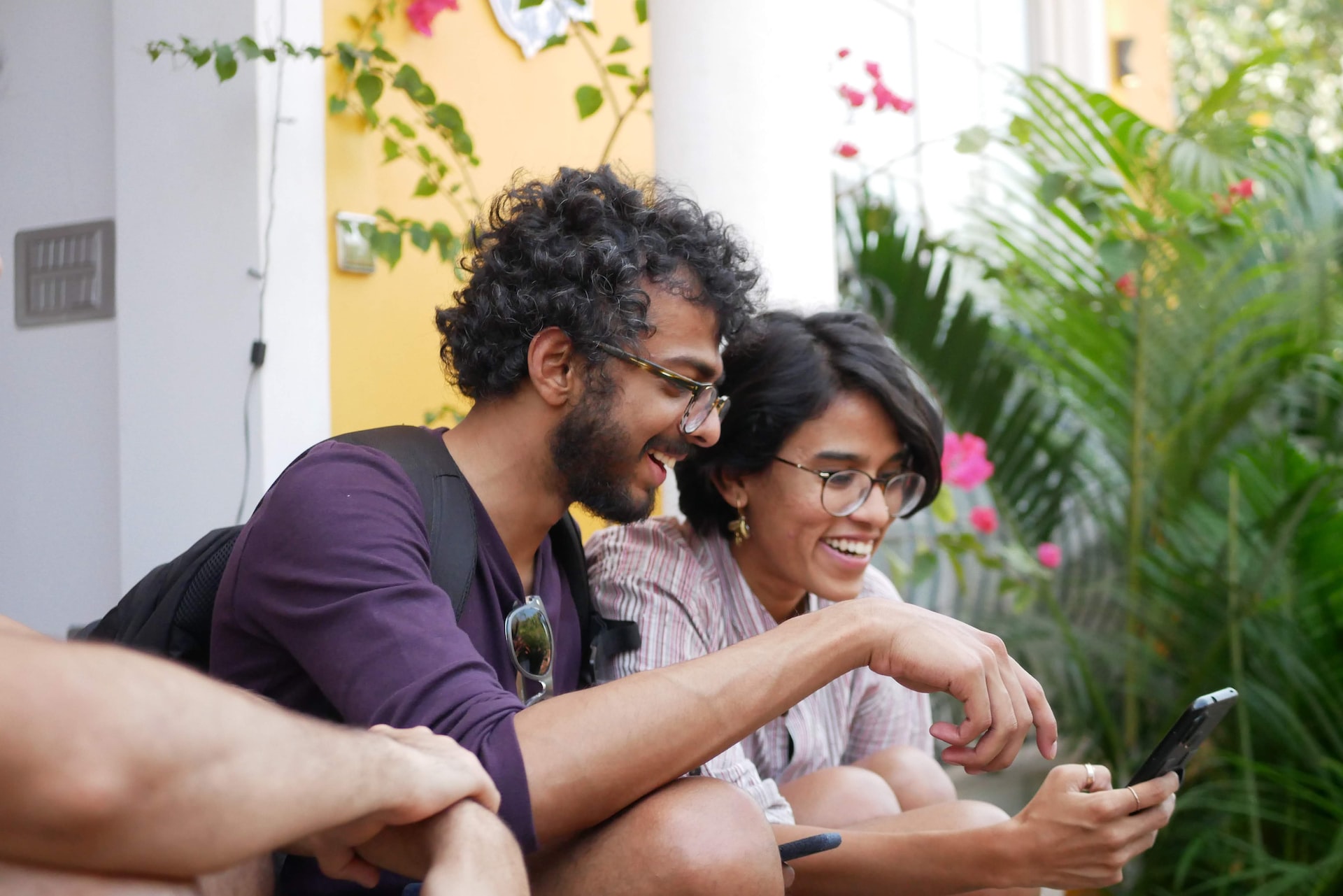 Two friends enjoying using an app on a smartphone