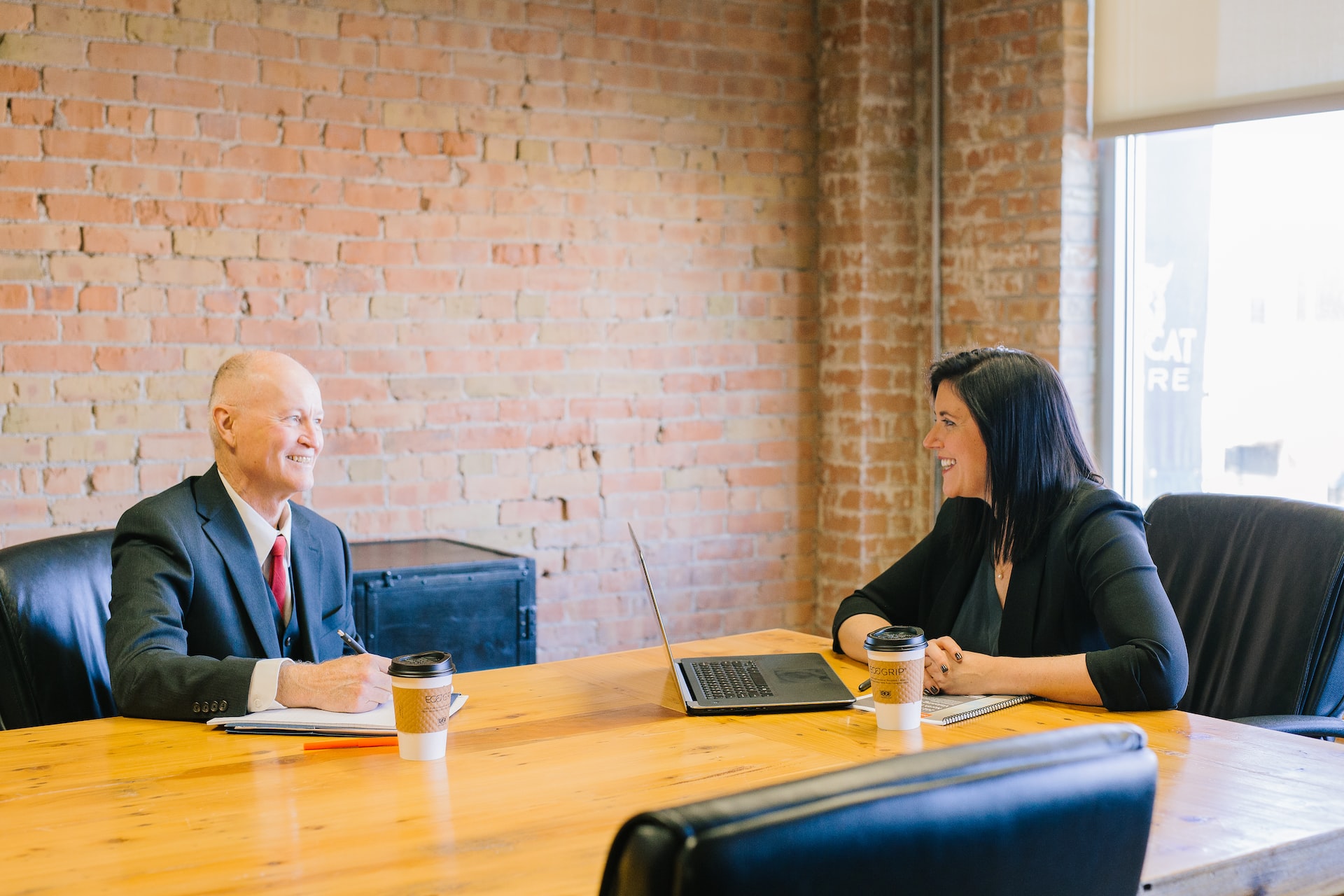 An entrepreneur meeting with an investor in a conference room