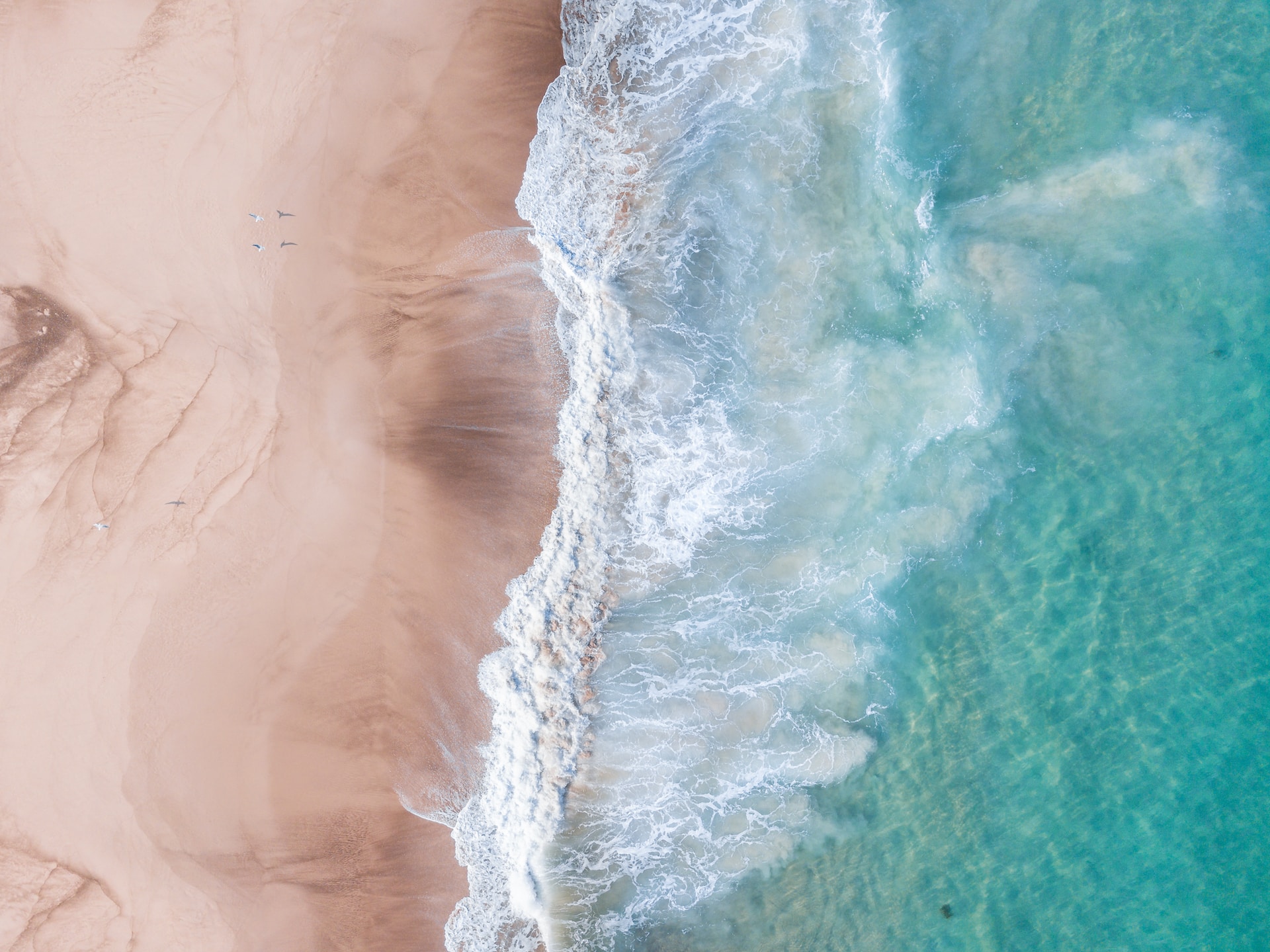 Waves against a sandy shore